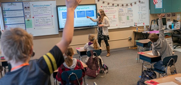 Teacher in front of classrooms