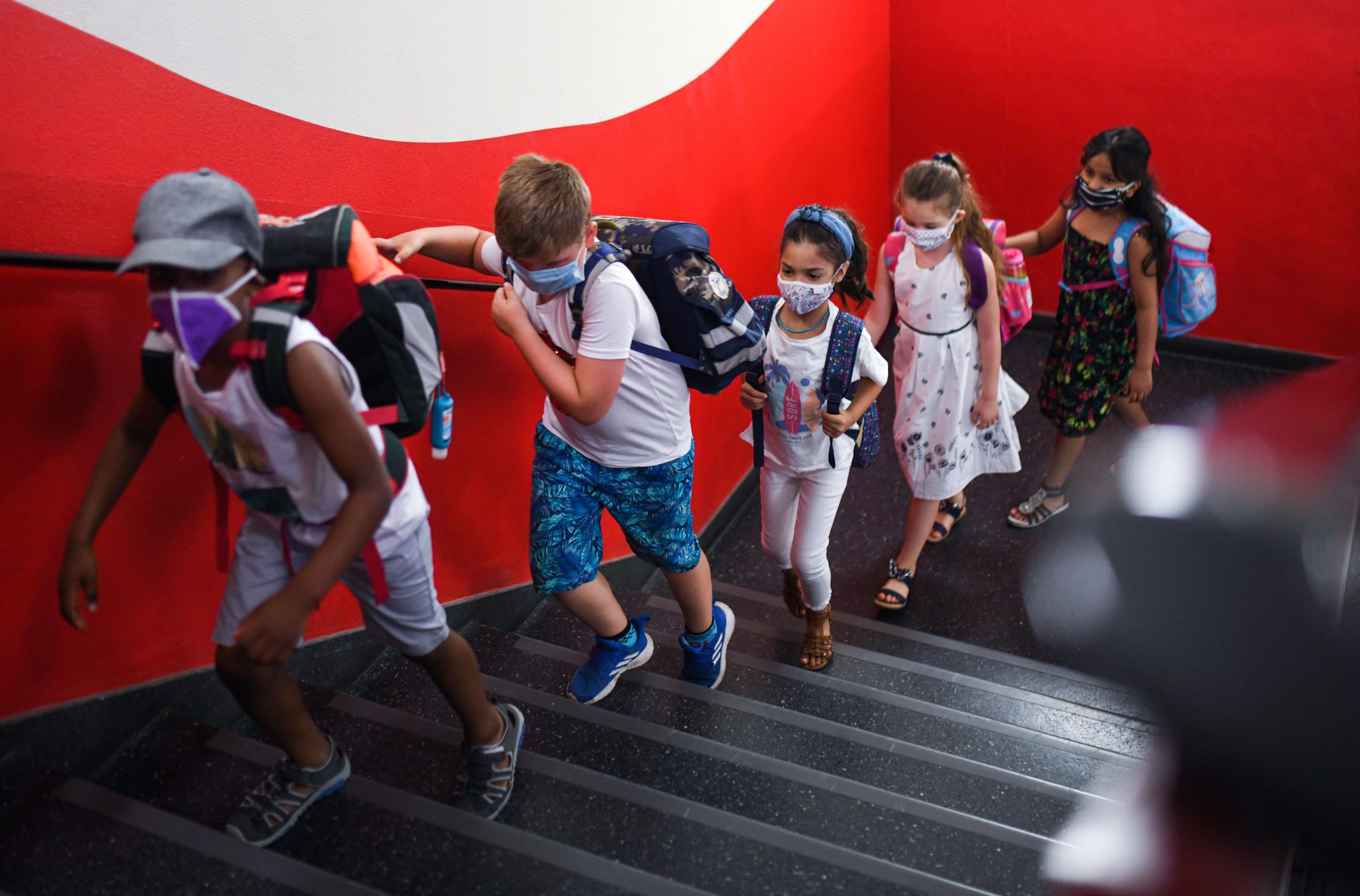 Students in hallway wearing masks